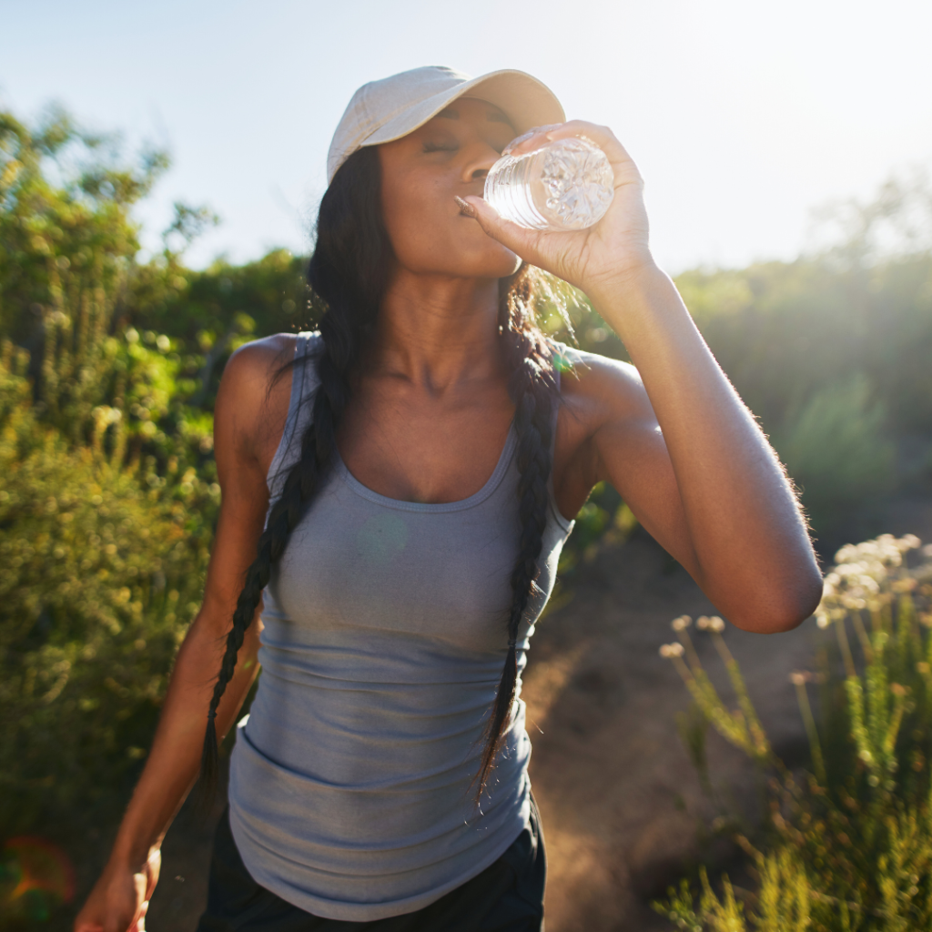 Woman drinking water bottle